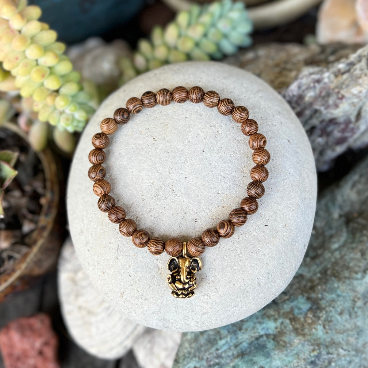 Embrace the fusion of nature and spirituality with "Ganesha's Wisdom - Wood Bracelet Set." Elevate your style while carrying the powerful symbolism of growth, strength, and overcoming obstacles with you. 