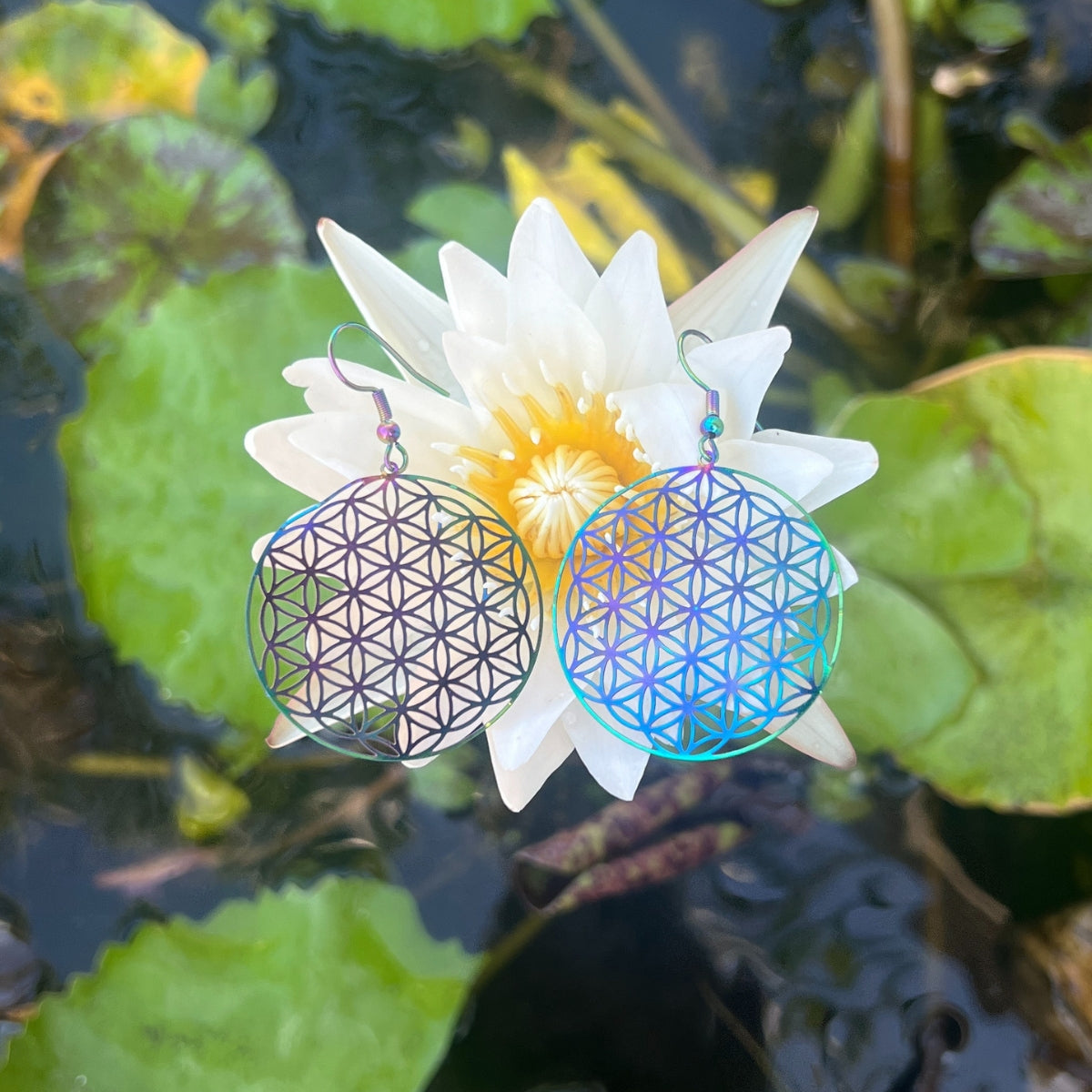 <strong>Wear the "Rainbow Flower of Life Earrings" to infuse your look with the vibrant colors of the rainbow and let them be a symbol of your unique, bohemian journey</strong>.