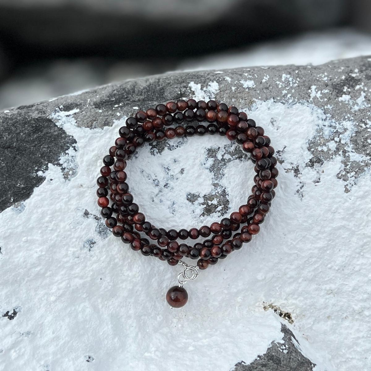 This Healing for Humanity Bracelet encourages us to giving back to our community through the healing properties of Red Tiger's Eye gemstone, which promotes balance, strength, and practical decision-making, providing individuals with the clarity and vision to make positive contributions to society.