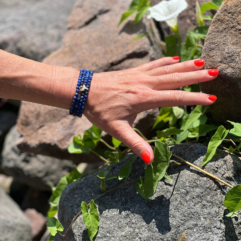 The Ocean Treasures Wrap Bracelet features stunning blue Lapis Lazuli stones that evoke the calming and peaceful essence of the ocean. Adding to the charm of the bracelet is the tiny gold dipped Shark Tooth charm. The Shark Tooth is a symbol of strength and resilience. Perfect for the Adrenaline Hunters and Shark Lovers