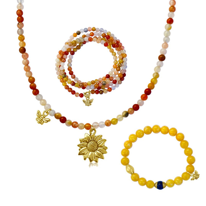 The Bee Happy Jewelry Set includes:  - Bee Happy Wrap Bracelet - Bee Happy Bracelet - Bee Happy Necklace