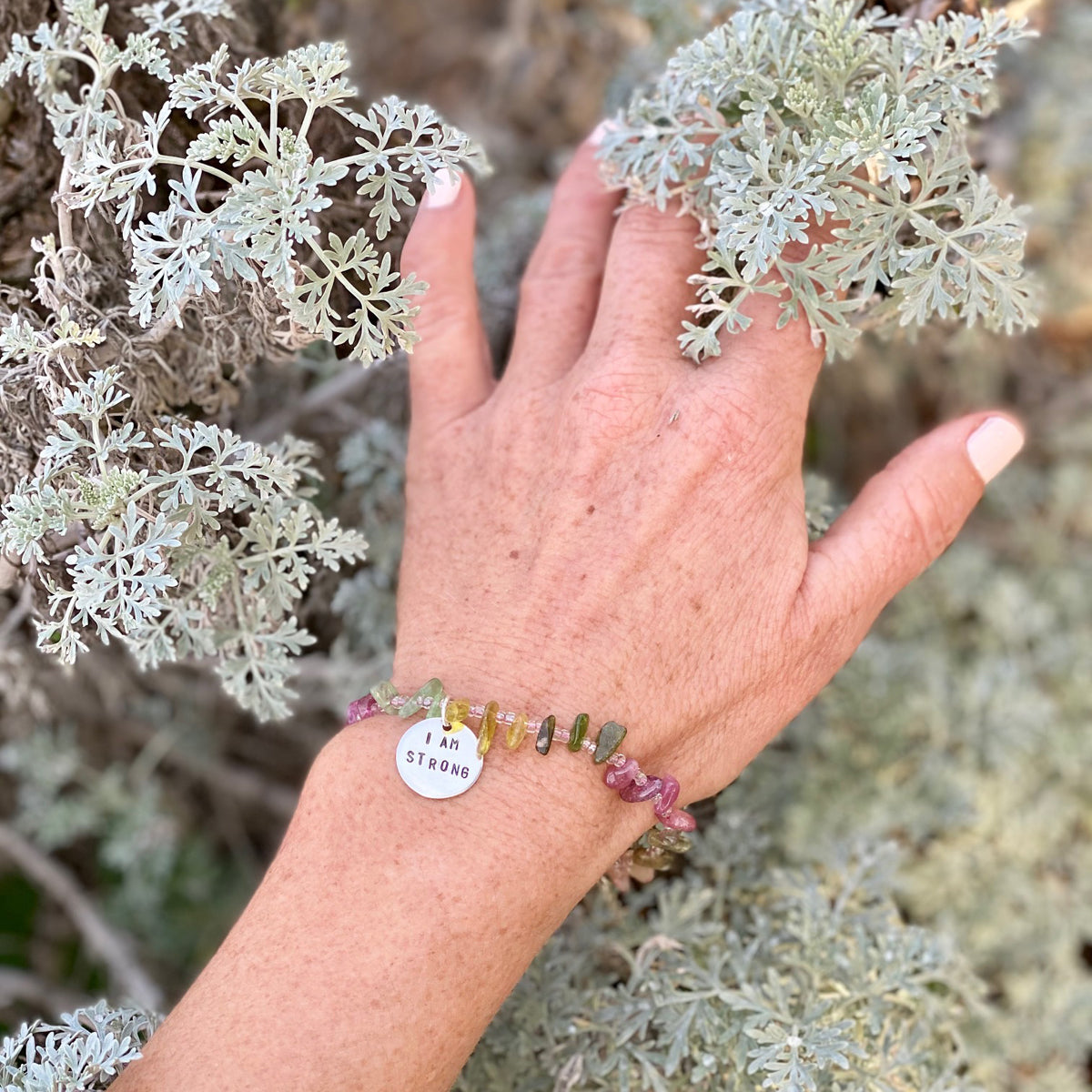 I am Strong Affirmation Bracelet with Tourmaline to Help Achieve Success. “I am” statements formulate, affirm, and perpetuate the stories you tell yourself. Stories about who you are, who you can be, and what you can do. Every “I am” is true, if you repeat it enough. 