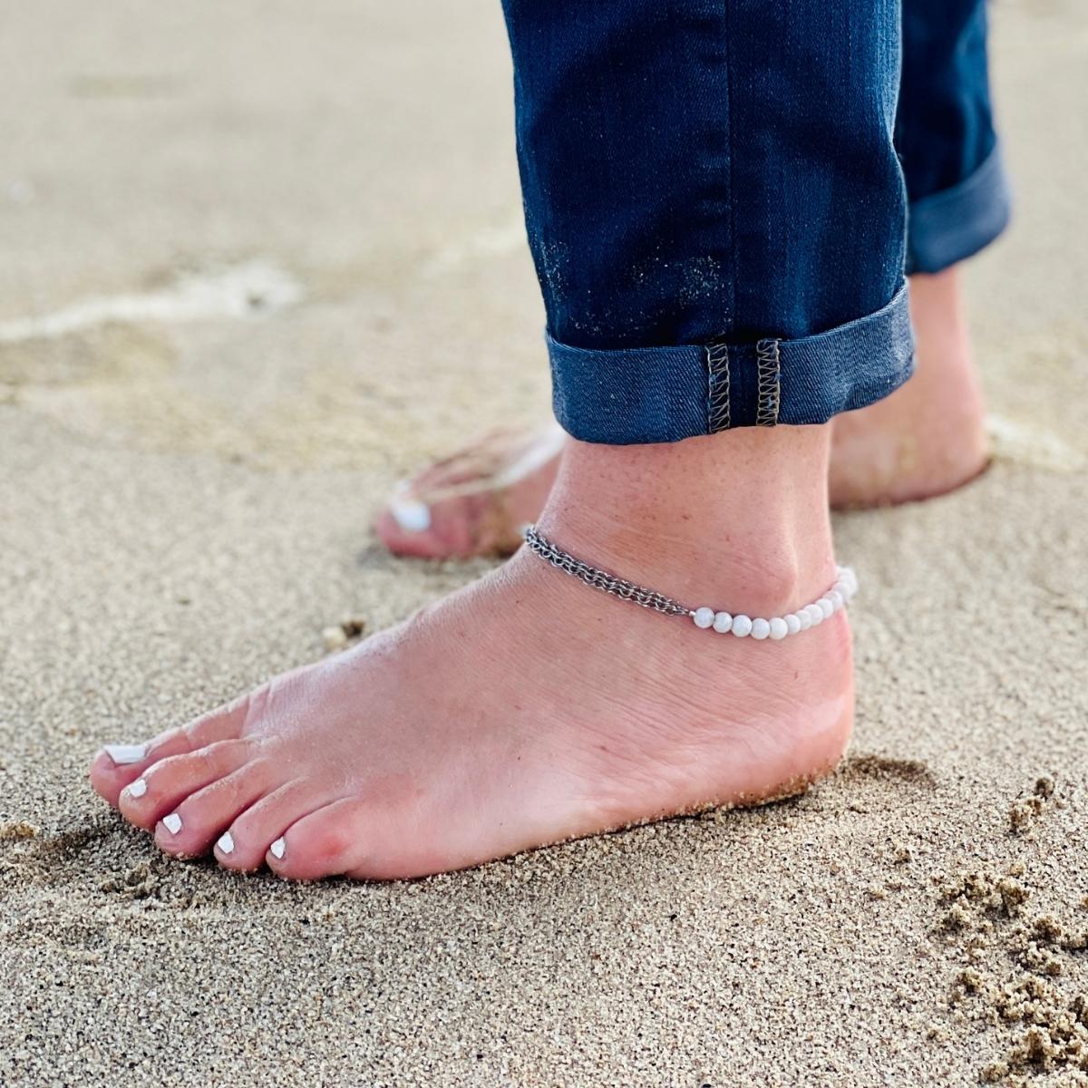 Neptunic SharkSuit Anklet - Sustainable Fashion for Ocean Lovers. People of the Water is dedicated to changing people's relationship with our aquatic world through Exploration, Education, and Conservation. Portions of the sale of this jewelry supports the People of the Water Non-Profit.