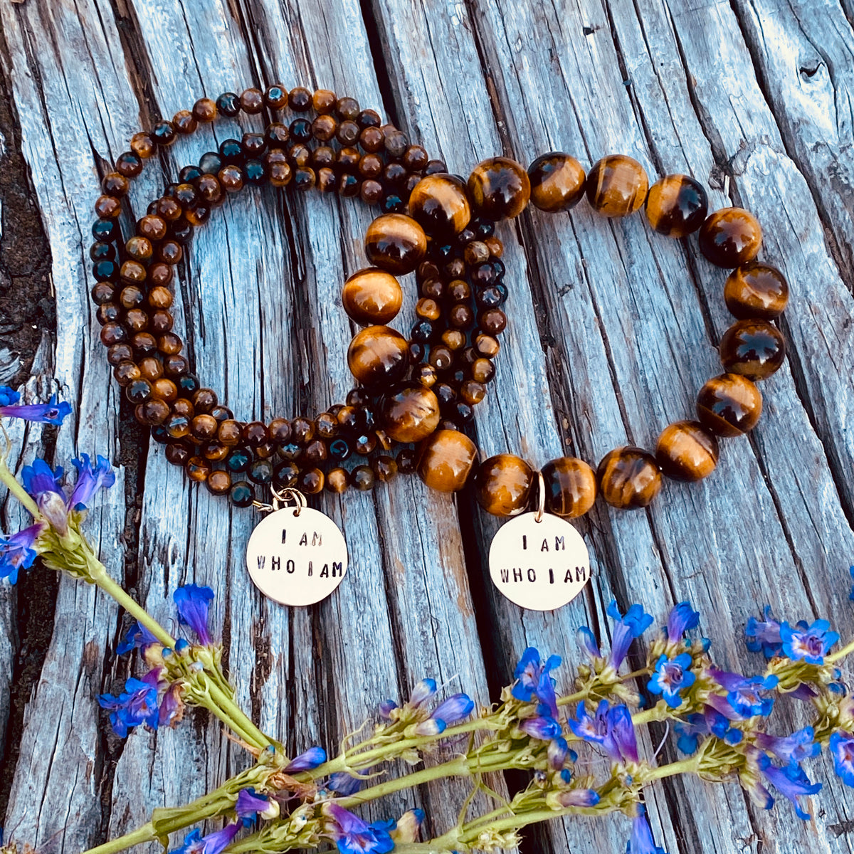 These gold holistic healing affirmation bracelets say, "I am...".