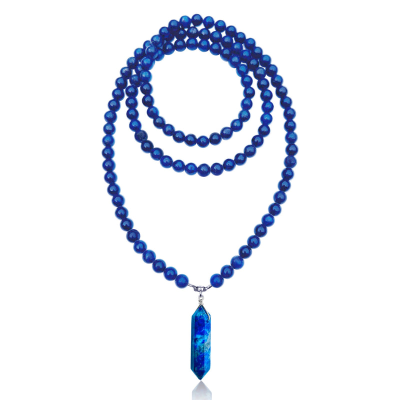 The Lapis Lazuli Meditation Necklace combines natural beauty with spiritual significance. The necklace features a double-pointed Lapis Lazuli stone, which is known for its deep blue color and unique veining.