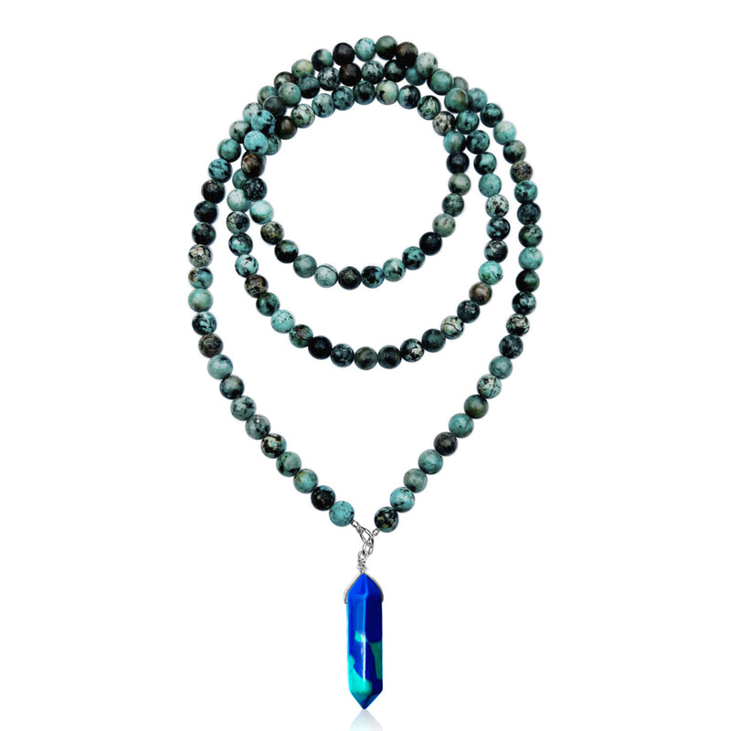 The Peaceful Waters Necklace: Chrysocolla and Turquoise brings you calming and soothing energy, promoting inner peace and tranquility.