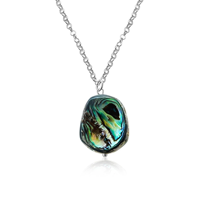"Coastal Treasures" is a necklace that celebrates the raw and untamed beauty of nature. At its heart, it features a rustic abalone piece, measuring approximately 1 to 1.5 inches, hanging gracefully from a sterling silver chain.