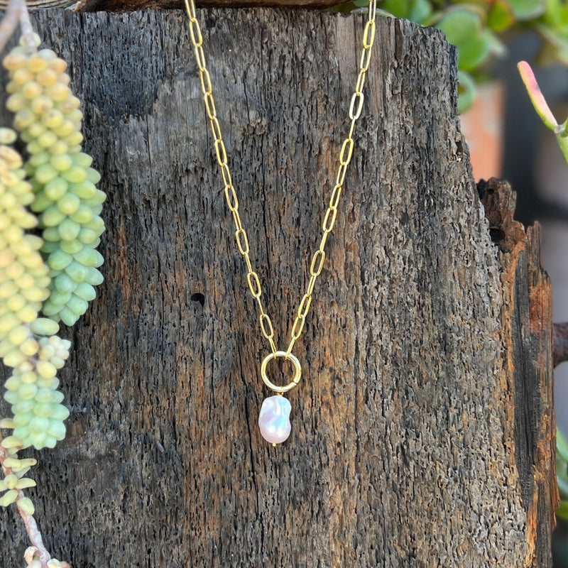 This Karma Cleanse - Pearl Necklace captures the raw beauty of nature's most transformative process.