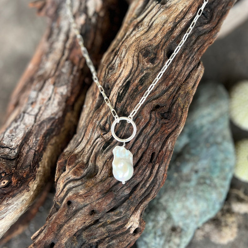 This Karma Cleanse - Pearl Necklace captures the raw beauty of nature's most transformative process. 