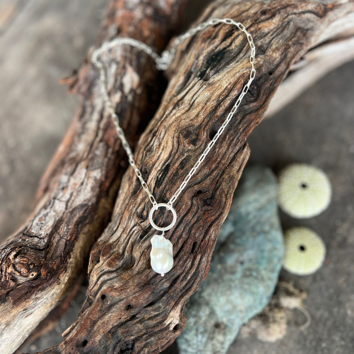 This Karma Cleanse - Pearl Necklace captures the raw beauty of nature's most transformative process. 
