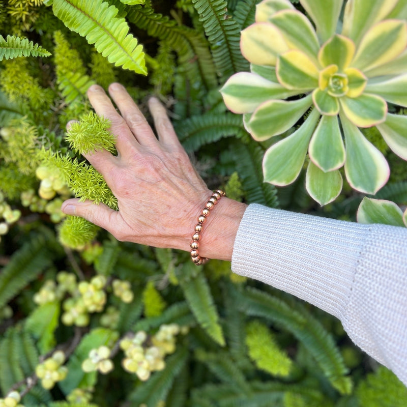 The Soul Tribe Bracelet, adorned with rose gold hematite, serves as a symbolic beacon of support and resilience, uniting wearers in their journey through life's challenges. 