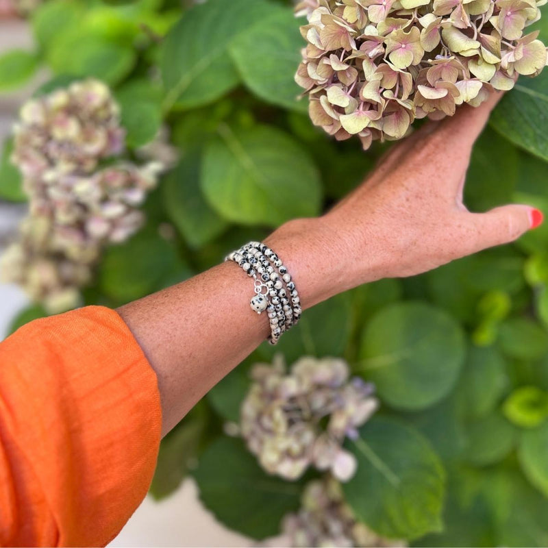 The Mindful Transitions Dalmatian Jasper Wrap Bracelet is a delightful and meaningful piece of jewelry that's all about helping you gracefully navigate life's ups and downs. 