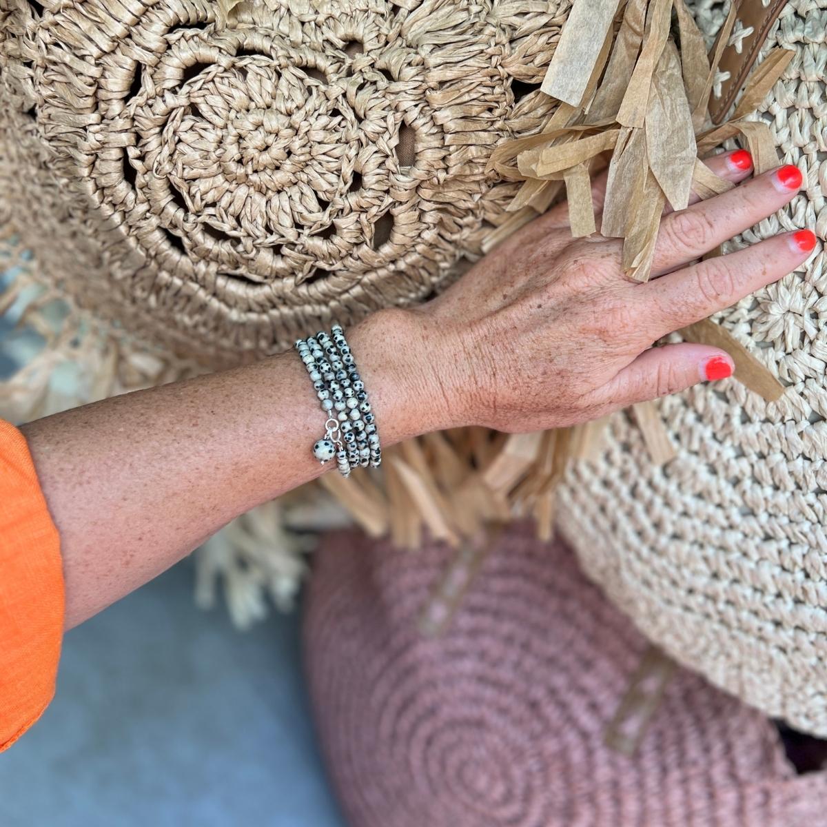 The Mindful Transitions Dalmatian Jasper Wrap Bracelet is a delightful and meaningful piece of jewelry that's all about helping you gracefully navigate life's ups and downs. 