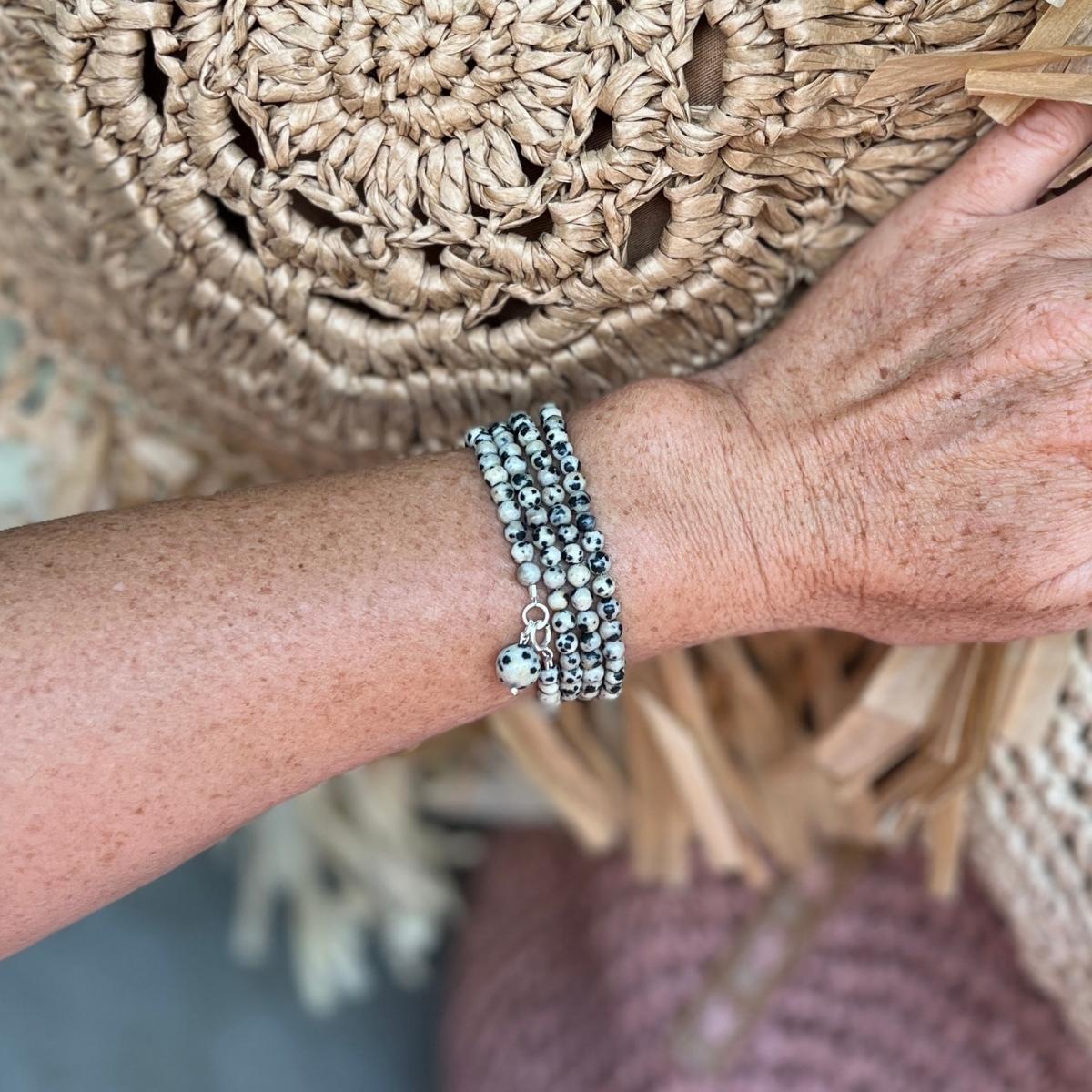 The Mindful Transitions Dalmatian Jasper Wrap Bracelet is a delightful and meaningful piece of jewelry that's all about helping you gracefully navigate life's ups and downs. 