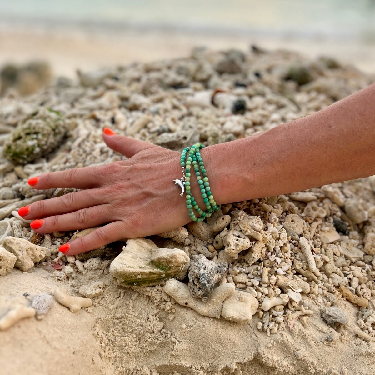 As you wear this Dolphin Spirit Wrap Bracelet, you'll feel a deep connection to the healing powers of the sea and the wisdom of the dolphins, guiding you on a journey of spiritual awakening and self-discovery.
