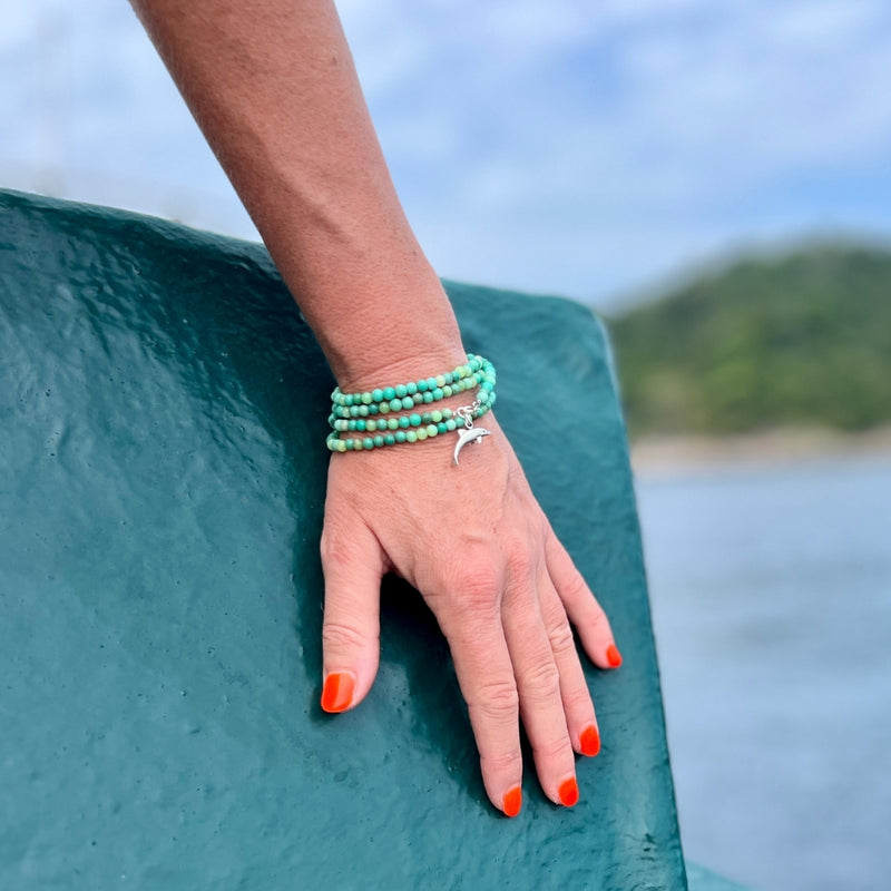 As you wear this Dolphin Spirit Wrap Bracelet, you'll feel a deep connection to the healing powers of the sea and the wisdom of the dolphins, guiding you on a journey of spiritual awakening and self-discovery.