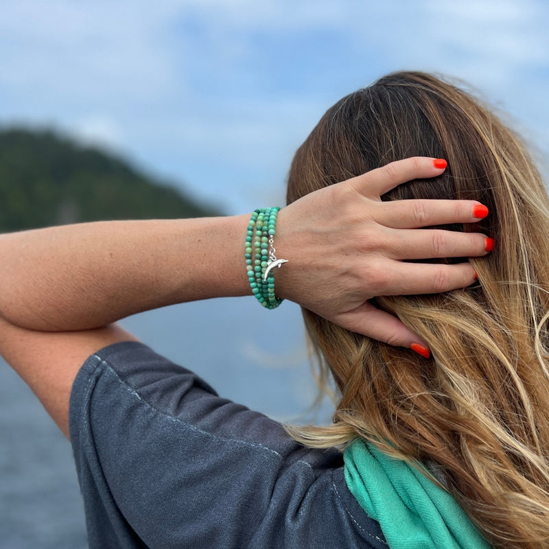 As you wear this Dolphin Spirit Wrap Bracelet, you'll feel a deep connection to the healing powers of the sea and the wisdom of the dolphins, guiding you on a journey of spiritual awakening and self-discovery.