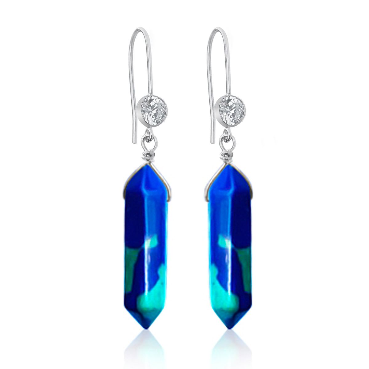 The Peaceful Waters Chrysocolla Earrings are a stunning pair of earrings that feature two polished Chrysocolla stones. Chrysocolla is known for its calming and soothing energy, promoting inner peace and tranquility.