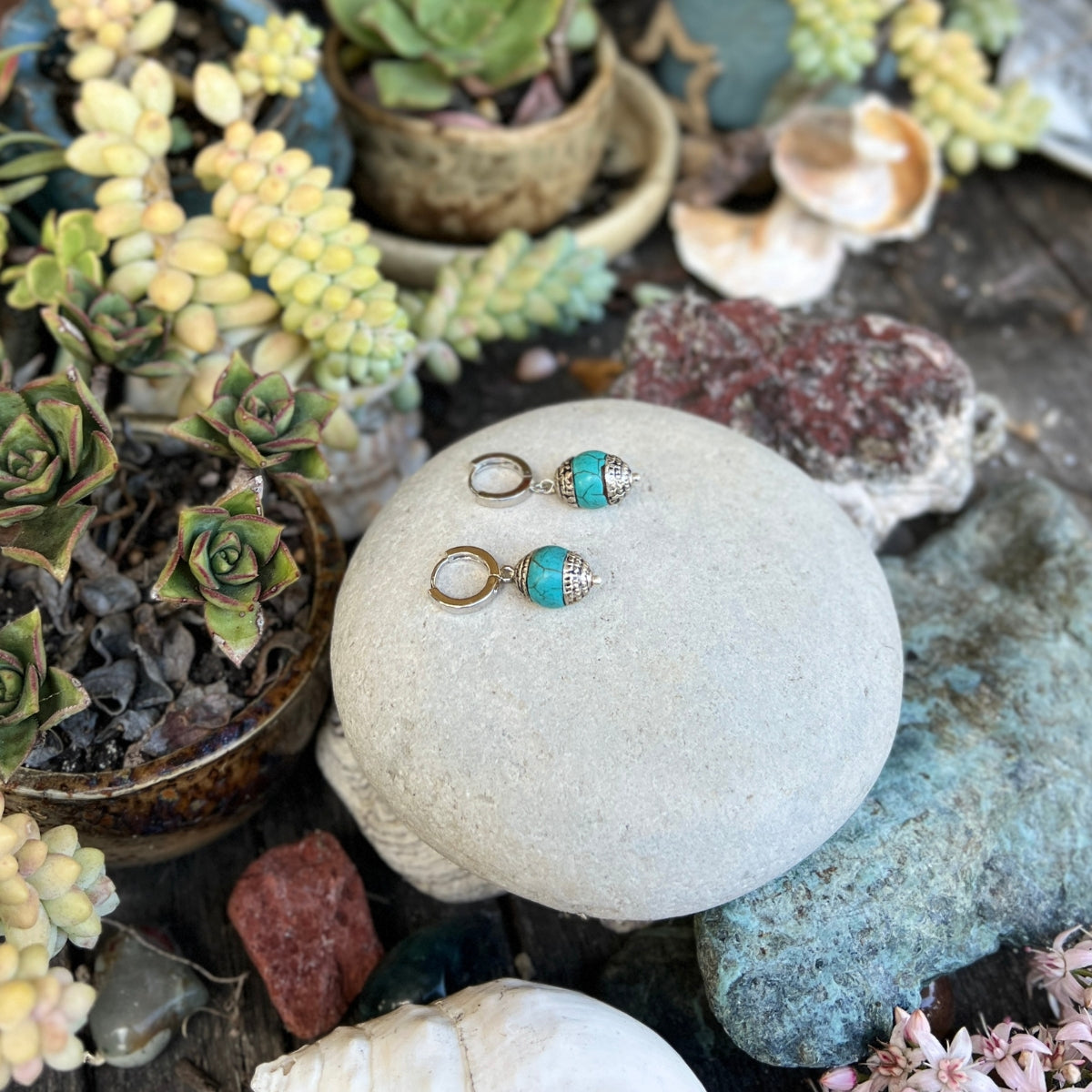 At the heart of the "Himalaya Harmony Earrings"  is a piece of Turquoise gemstone. Turquoise is a purification stone. Its energy is excellent for depression and exhaustion, it also has the power to prevent panic attacks. Turquoise is believed to bring luck.