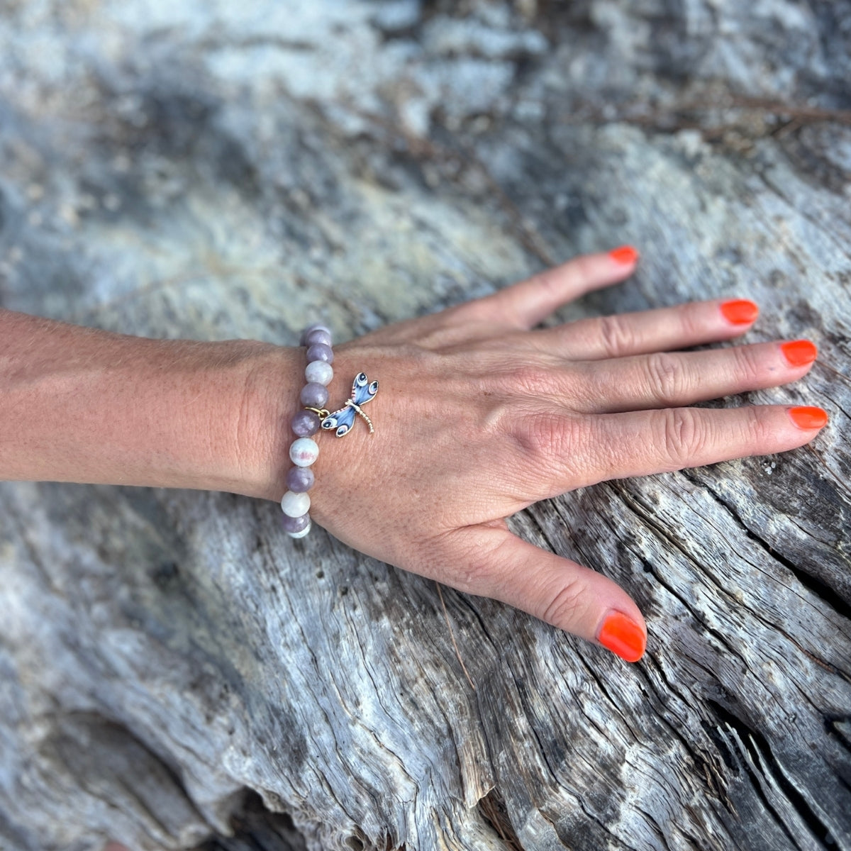 Let the Dragonfly Whispers - Lepidolite Bracelet be your guide, inspiring you to navigate the winds of change with grace, embrace the journey of self-reflection, and reveal your inner light with confidence at every turn.