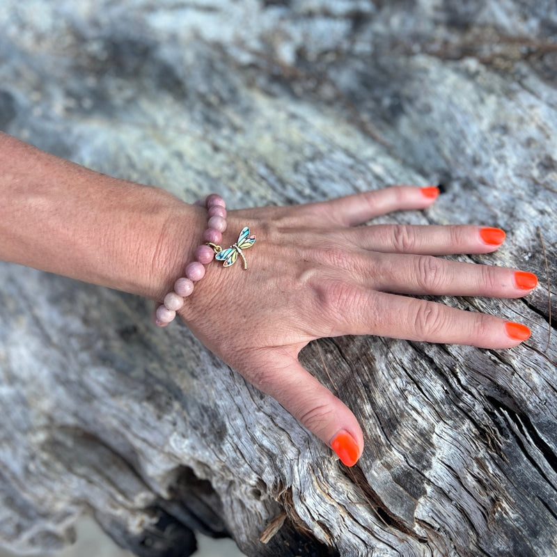 Immerse yourself in the journey of heartful transformation with the Dragonfly Whispers - Rhodonite Bracelet, your companion in embracing life's ebbs and flows with love and grace.