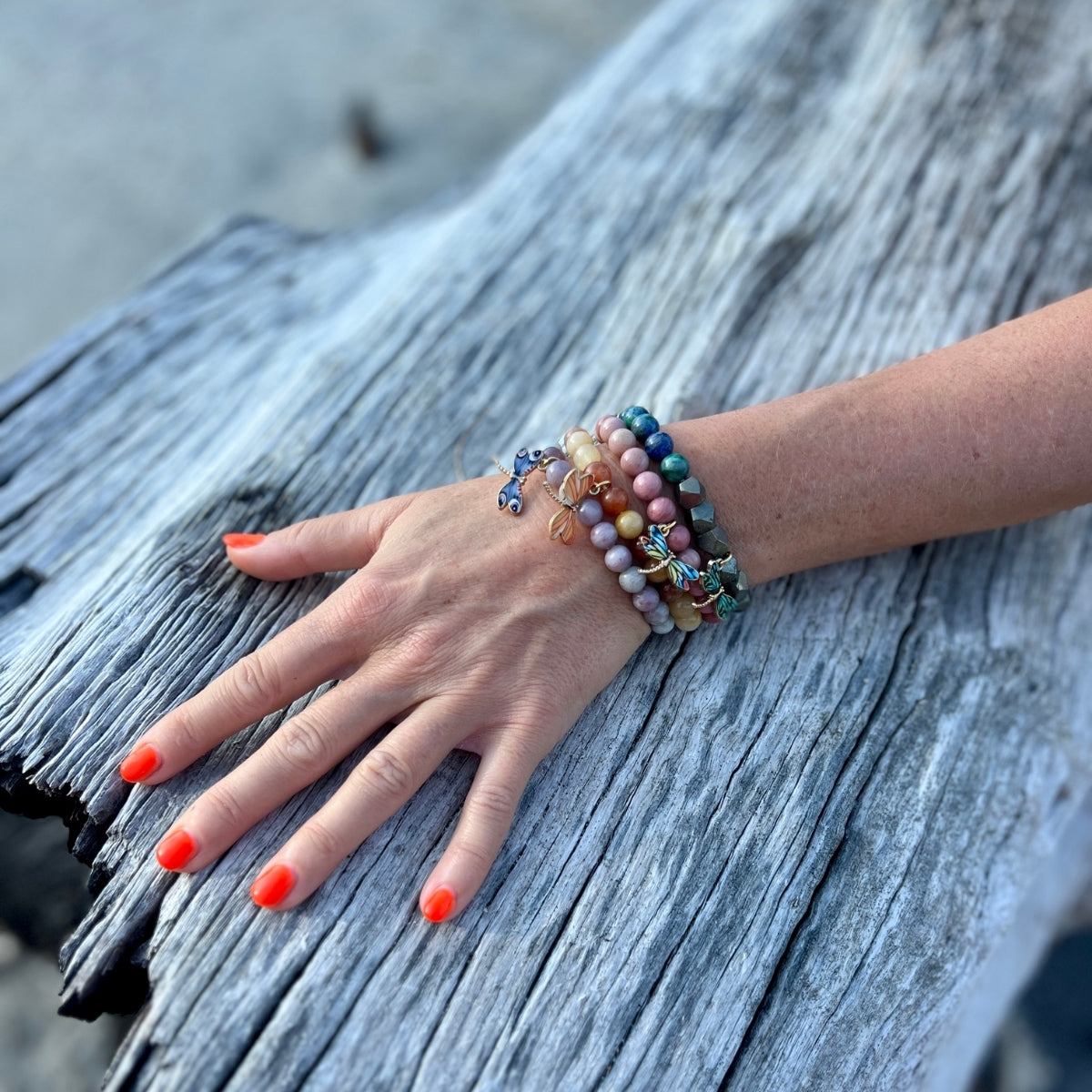 Embrace the harmony of transformation with the Dragonfly Whispers Bracelet Stack, a symbol of empowerment and balance, guiding you to navigate life's twists and turns with resilience and grace.