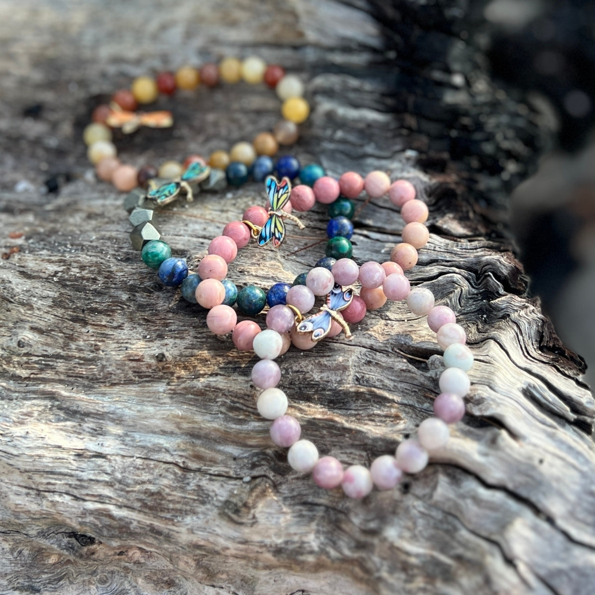 Embrace the harmony of transformation with the Dragonfly Whispers Bracelet Stack, a symbol of empowerment and balance, guiding you to navigate life's twists and turns with resilience and grace.