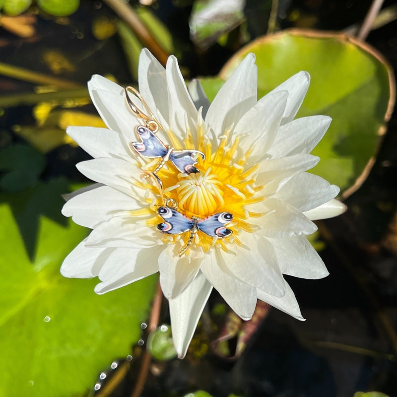 The Dragonfly Whispers Earrings are tokens of resilience and inner strength. Like the dragonfly's fleeting yet powerful flight, they inspire you to navigate life's transitions with courage and grace