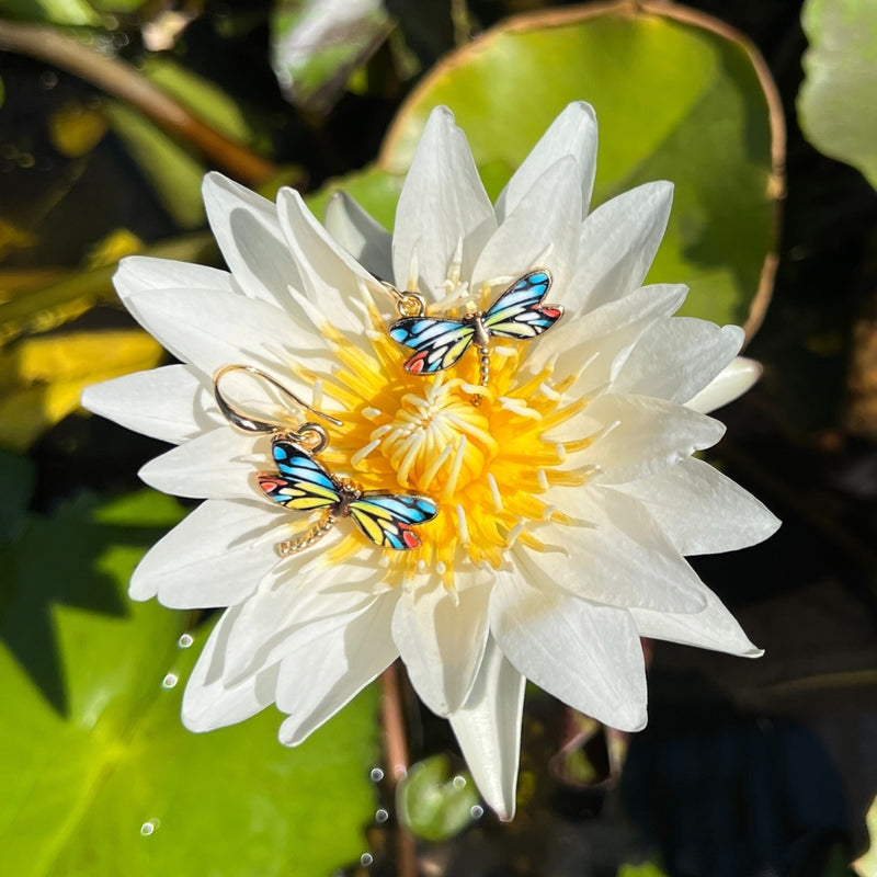 The Dragonfly Whispers Earrings are tokens of resilience and inner strength. Like the dragonfly's fleeting yet powerful flight, they inspire you to navigate life's transitions with courage and grace