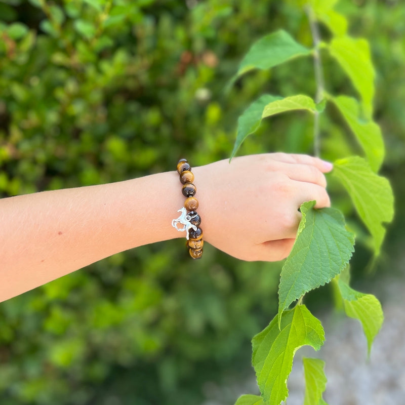 Wild Spirit - Horse Bracelet with Tiger Eye is a beautifully crafted accessory that captures the essence of freedom and strength, appealing to both kids and adults alike.