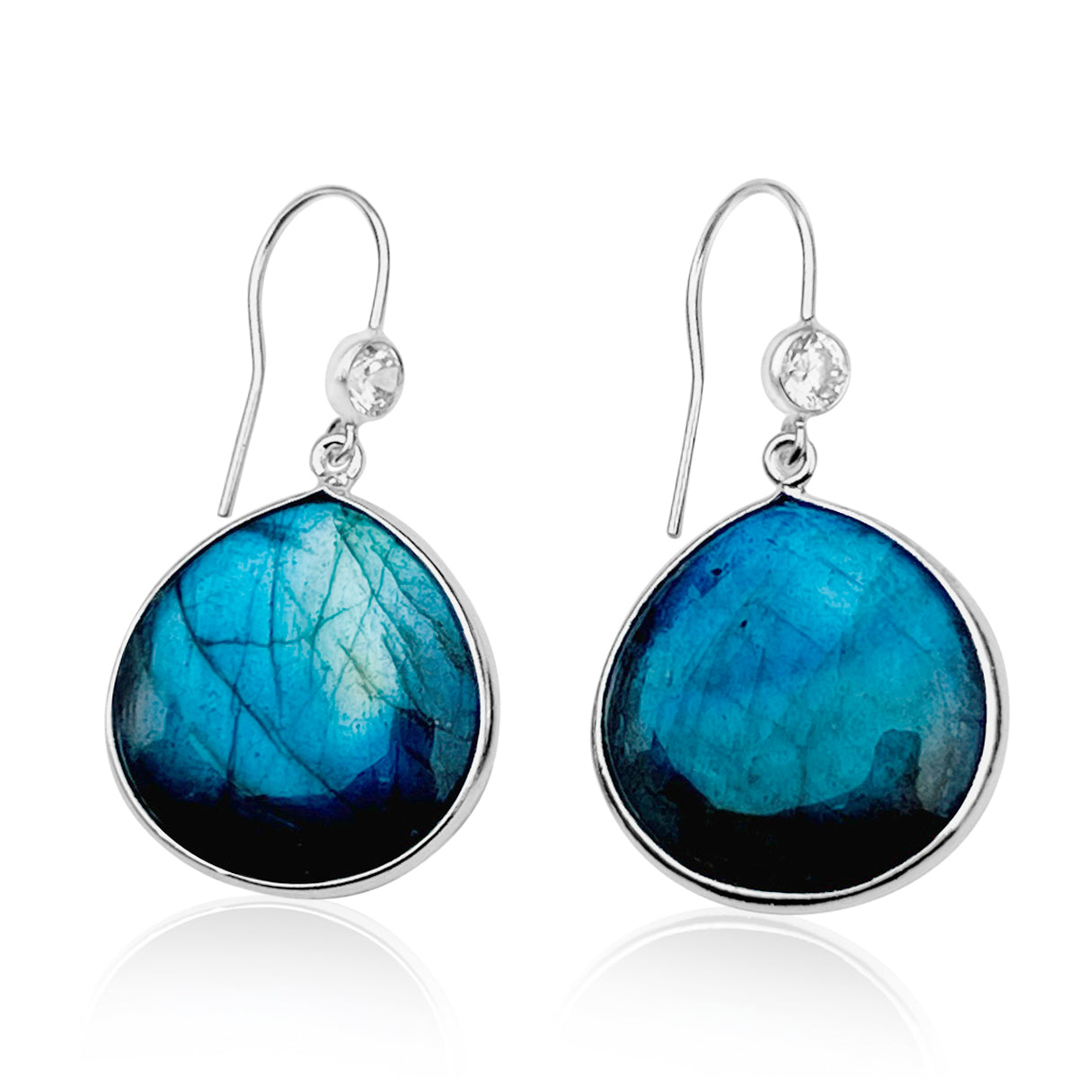 The Magic Mindset Labradorite Earrings are a beautiful pair of sterling silver earrings that feature stunning, teardrop-shaped labradorite stones as their centerpiece. Labradorite is a unique crystal known for its iridescent hues and ability to enhance intuition and spiritual awareness.
