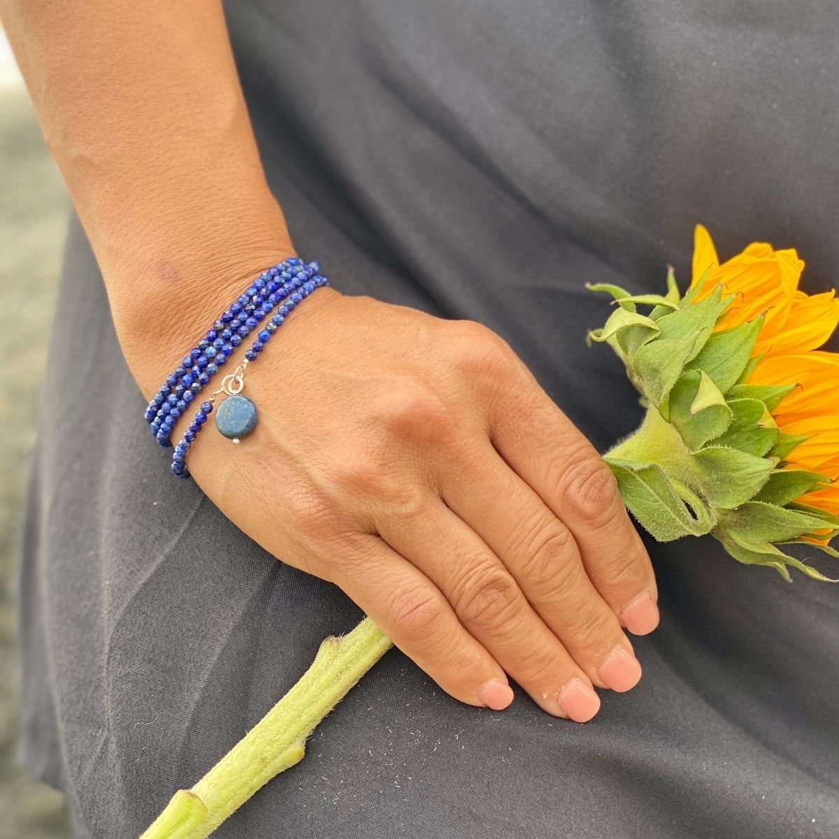 The Lapis Lazuli Meditation Necklace, Wrap Bracelet and Earring Set combines natural beauty with spiritual significance.