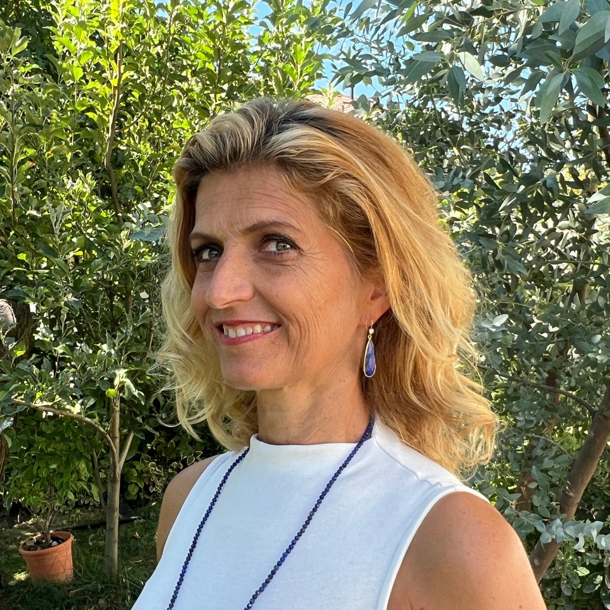 Woman wearing the Ancient Skies: Lapis Lazuli Earrings