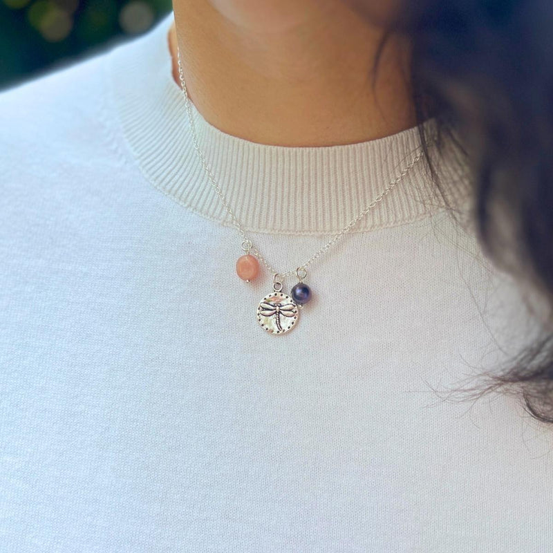 Wearing our "Dragonfly Dreams Necklace" is like carrying a piece of nature's beauty and positive energy with you. It serves as a reminder to embrace life's changes gracefully, find joy in the present moment, and cultivate inner wisdom. 