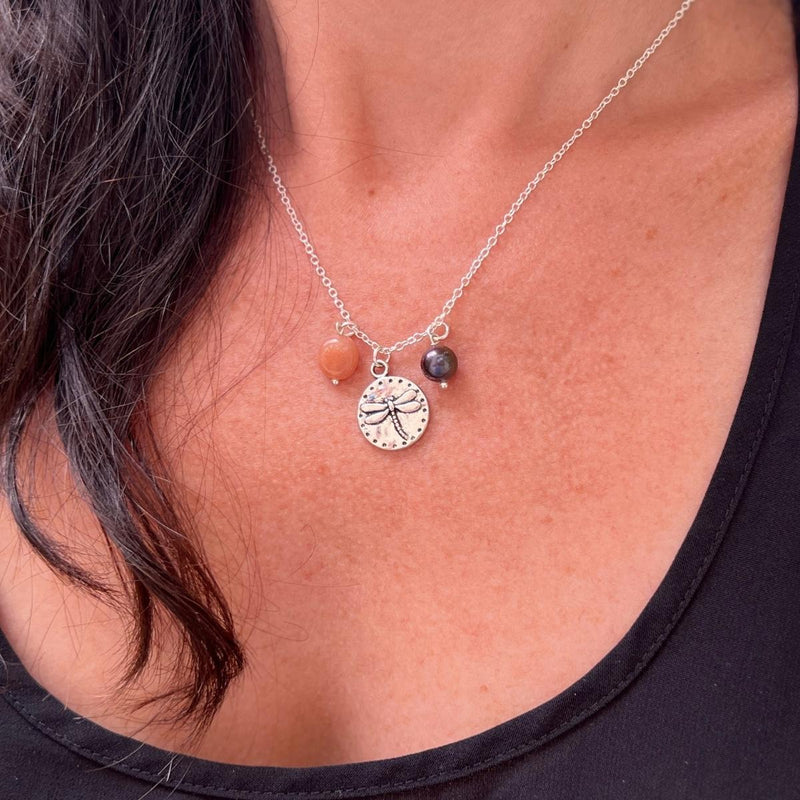 Wearing our "Dragonfly Dreams Necklace" is like carrying a piece of nature's beauty and positive energy with you. It serves as a reminder to embrace life's changes gracefully, find joy in the present moment, and cultivate inner wisdom. 