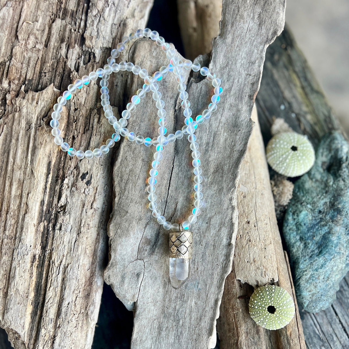 This Mermaid's Sanctuary Necklace is for anyone who needs both protection and peace—a shield that doesn't harden you, but instead surrounds you with light.