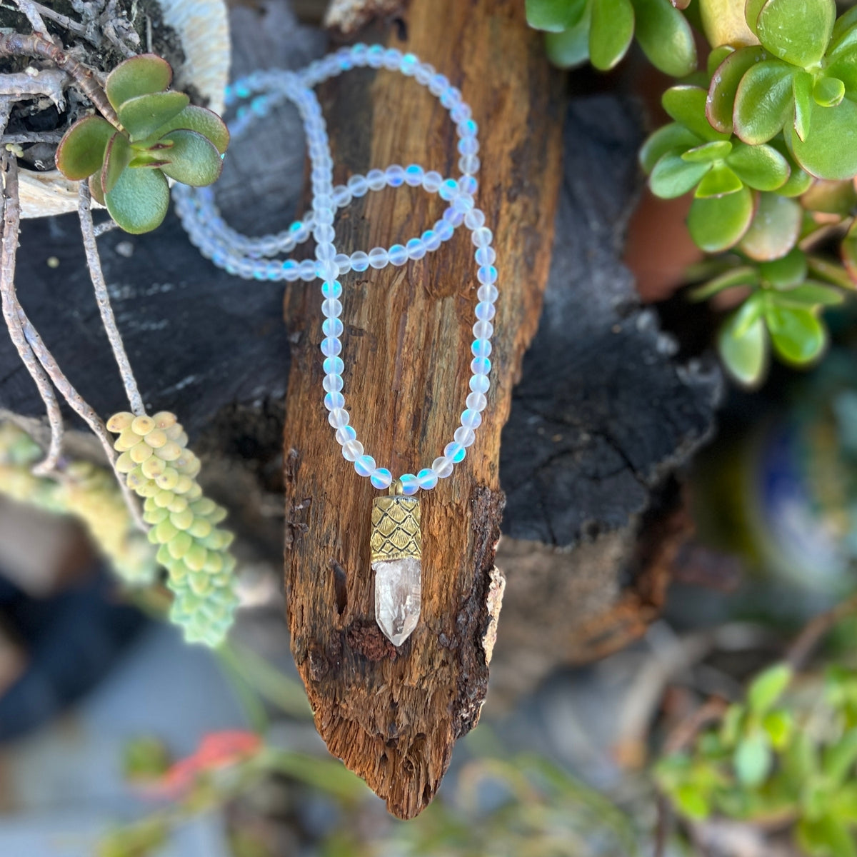 This Mermaid's Sanctuary Necklace is for anyone who needs both protection and peace—a shield that doesn't harden you, but instead surrounds you with light.