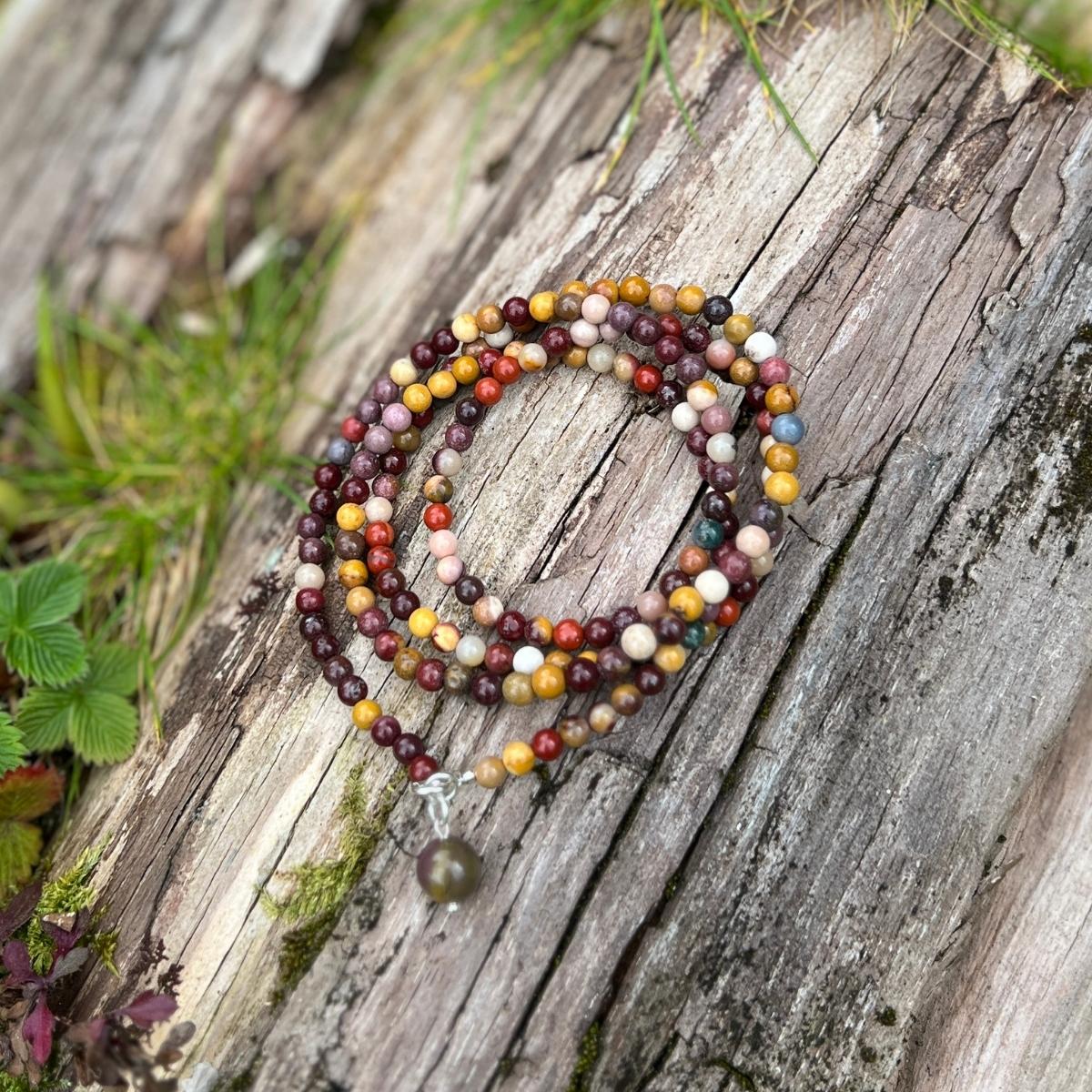 A bracelet made of Mookaite that enriches one's trust and love for Mother Earth., This Serene Symbiosis Mookaite Wrap Bracelet has the ability to ground one's mind, heart, and soul to the planet and connect with all sentient beings, creating a peaceful and harmonious coexistence.