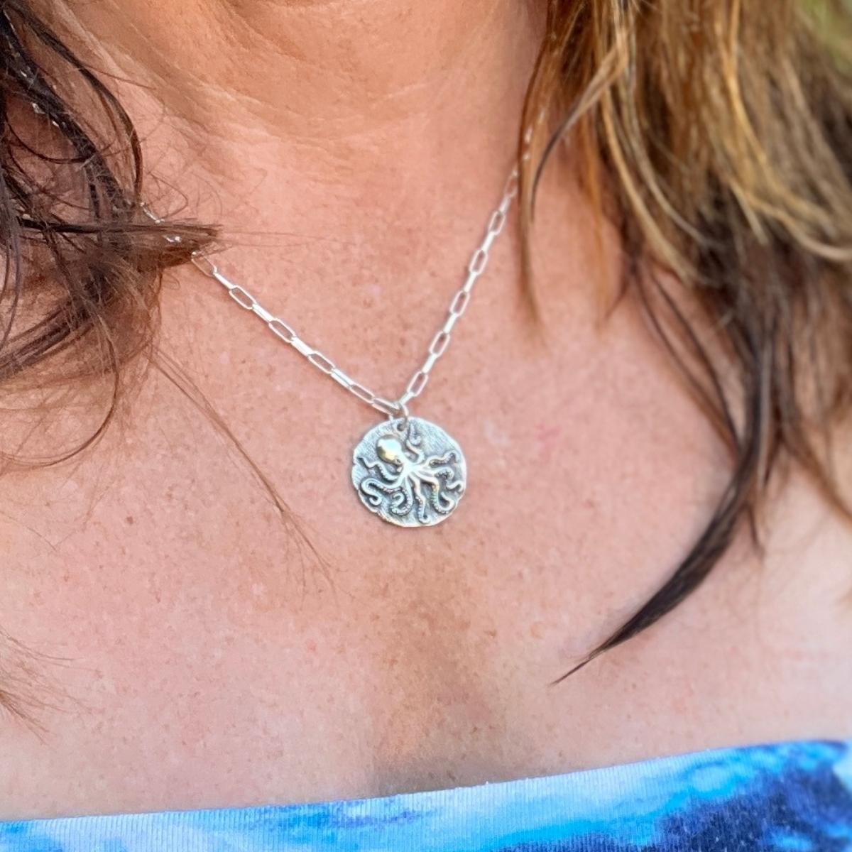 As you adorn yourself with this "Champion of Change: Octopus Necklace", let it symbolize your own journey of transformation, a reminder that just like the octopus, you too are a champion of change in the tapestry of life.