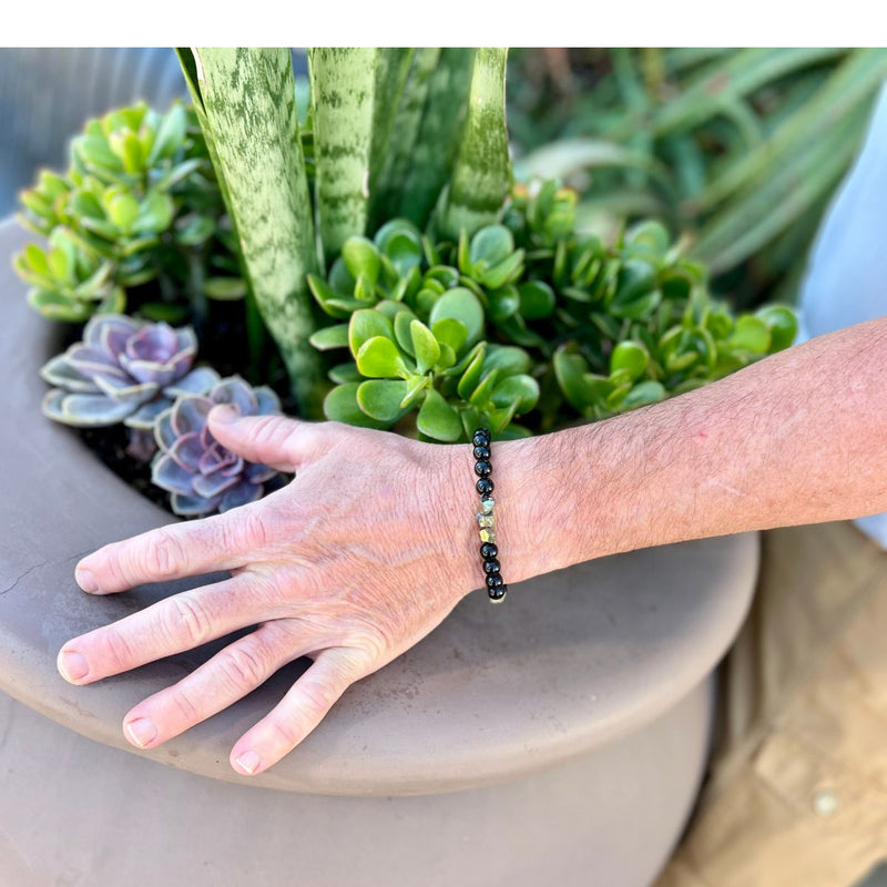 Introducing the "Resilience Surge - Onyx & Pyrite  Bracelet," a mindful fusion of strength, gemstone healing, and style that invites you to embark on a journey of inner fortitude and vibrant living. 