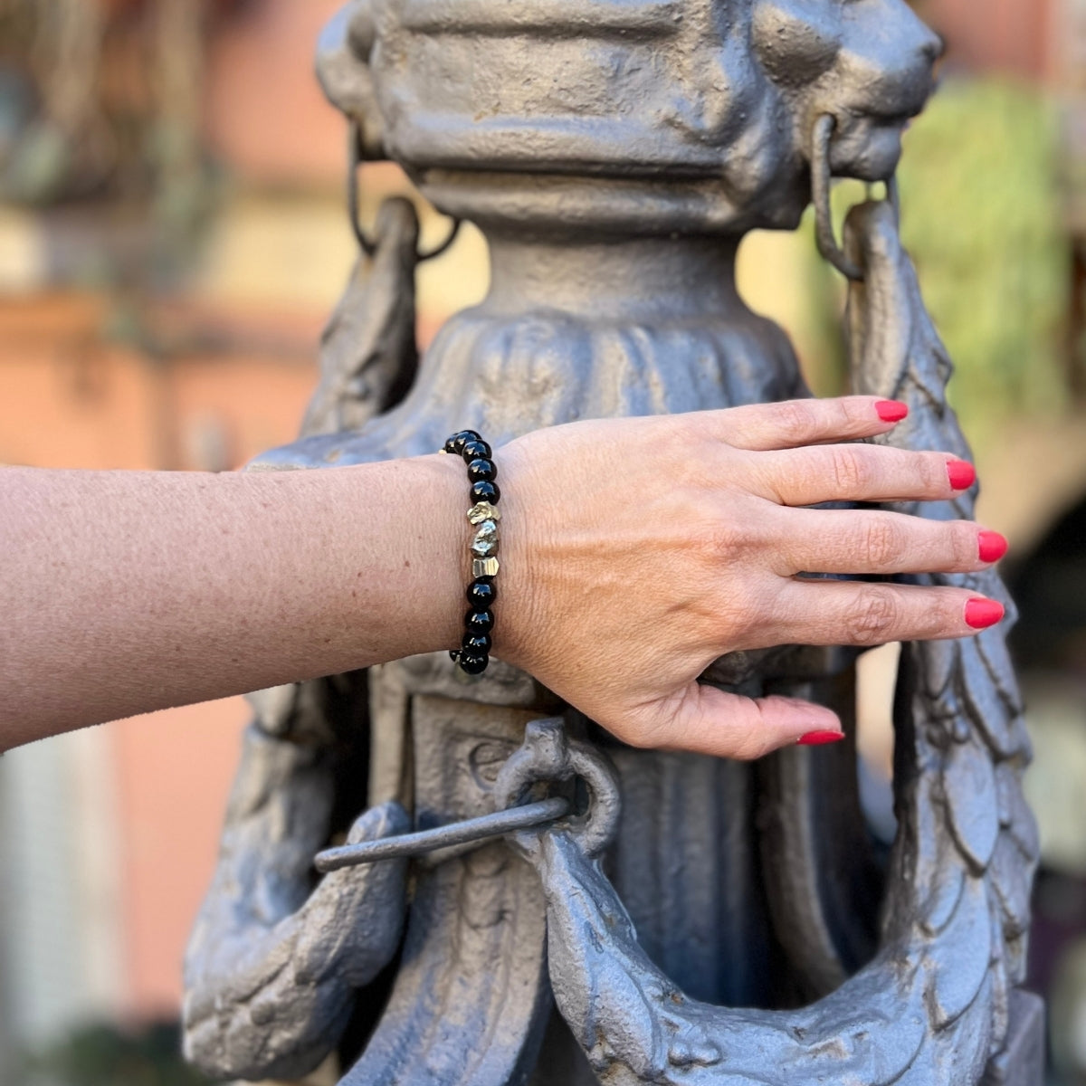 Introducing the "Resilience Surge - Onyx & Pyrite  Bracelet," a mindful fusion of strength, gemstone healing, and style that invites you to embark on a journey of inner fortitude and vibrant living.