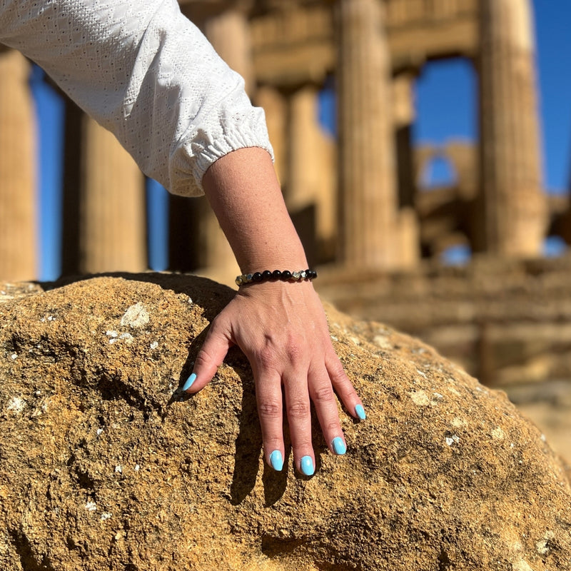 Introducing the "Resilience Surge - Onyx & Pyrite  Bracelet," a mindful fusion of strength, gemstone healing, and style that invites you to embark on a journey of inner fortitude and vibrant living.