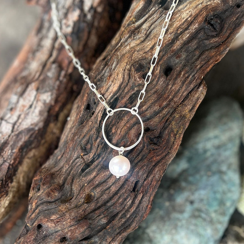 This Karma Cleanse - Pearl Necklace captures the raw beauty of nature's most transformative process. 