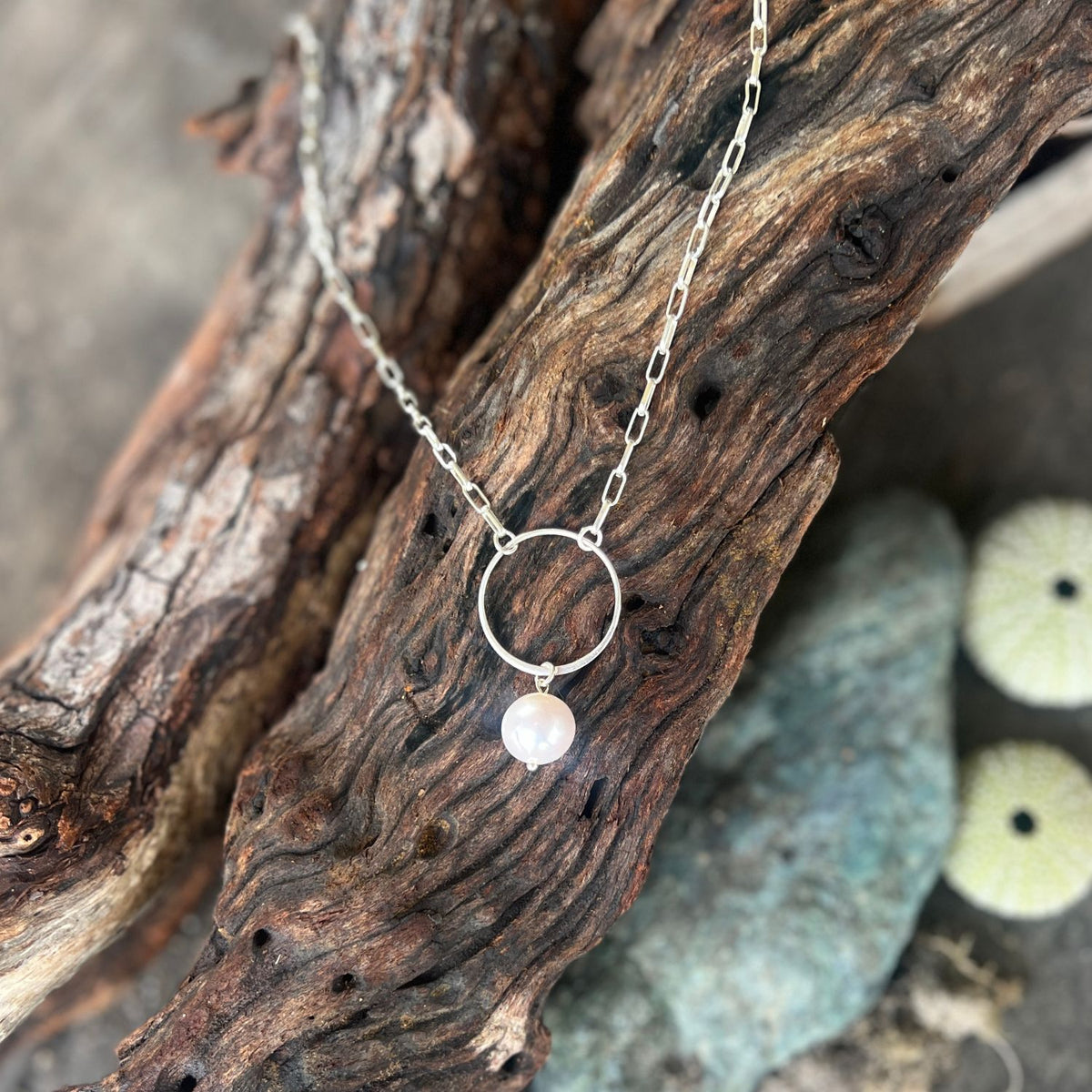 This Karma Cleanse - Pearl Necklace captures the raw beauty of nature's most transformative process. 