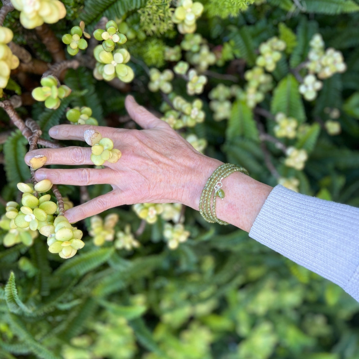 Immerse yourself in the magic of this Peridot Prosperity Wrap Bracelet, as it whispers tales of renewal and abundance, urging you to step boldly into the realm of possibility. 