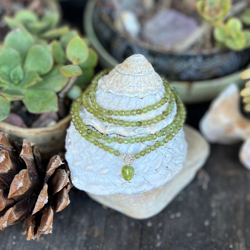 Immerse yourself in the magic of this Peridot Prosperity Wrap Bracelet, as it whispers tales of renewal and abundance, urging you to step boldly into the realm of possibility. 