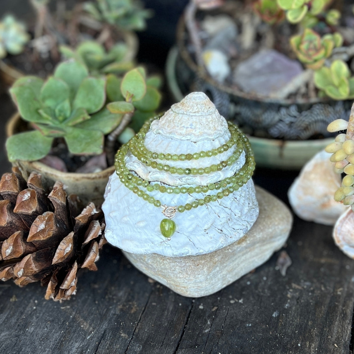 Immerse yourself in the magic of this Peridot Prosperity Wrap Bracelet, as it whispers tales of renewal and abundance, urging you to step boldly into the realm of possibility. 