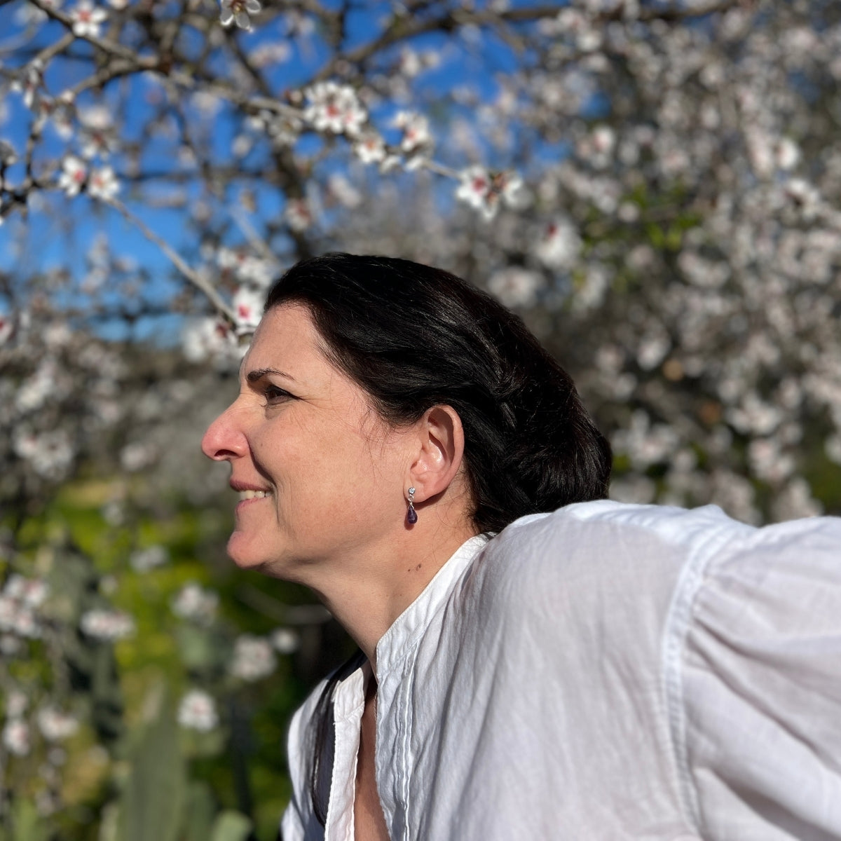 The enchanting Petite Sparkle - Amethyst Earrings designed for free-spirited individuals with a penchant for crystal healing and positive vibes, these earrings are a testament to both elegance and spiritual connection.