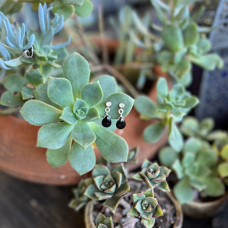 The alluring Petite Sparkle - Onyx Earrings, thoughtfully designed for individuals who embrace a free-spirited lifestyle, resonate with crystal healing, and seek the grounding energy of onyx.