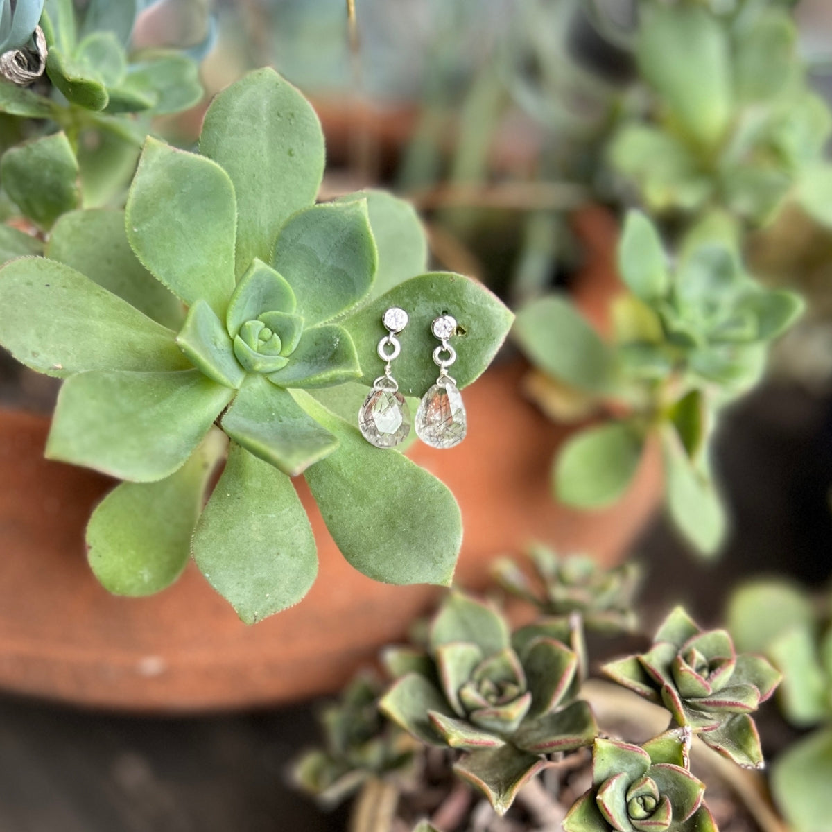 The captivating Petite Sparkle - Rutilated Quartz Earrings are meticulously crafted for individuals who embody a free-spirited lifestyle, resonate with crystal healing, and seek the mesmerizing energy of Rutilated Quartz. 